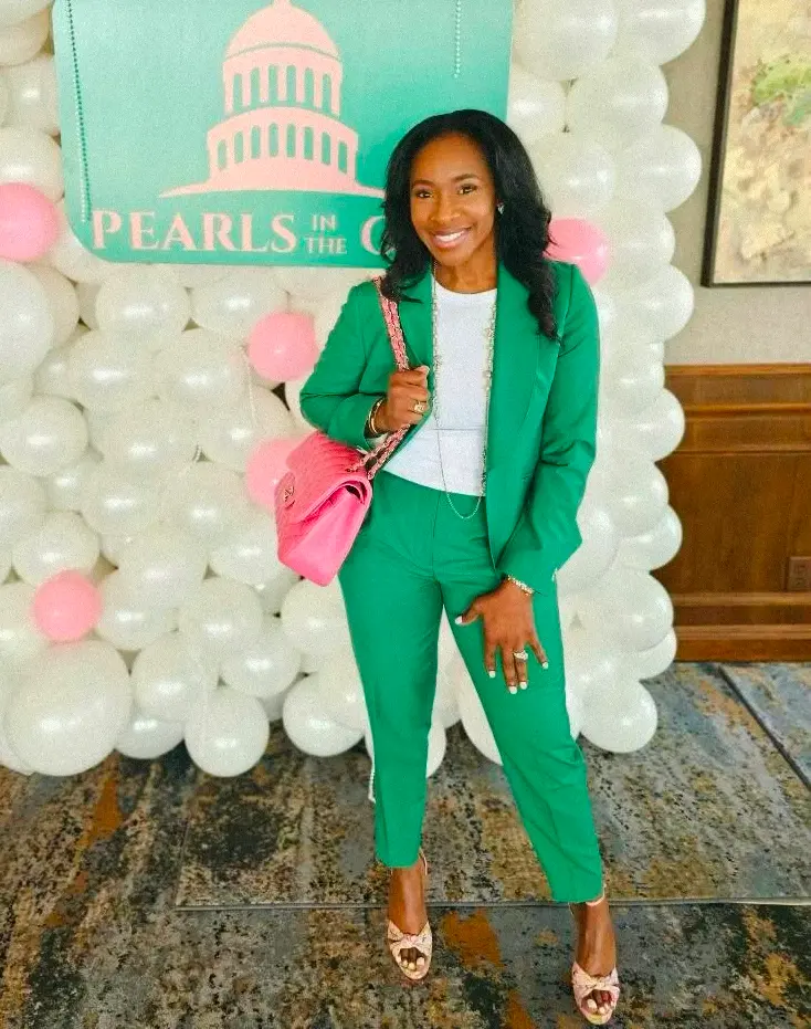 Woman using an opened white blazer